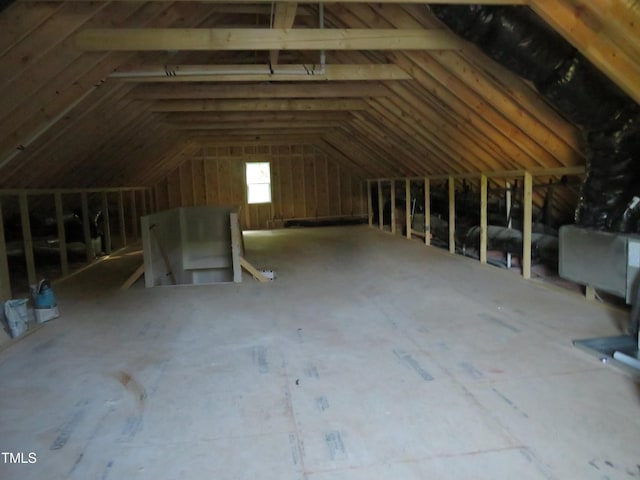 attic featuring an upstairs landing