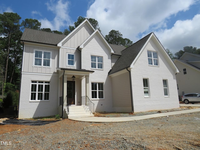 1444 Old Apex Rd, Cary, NC 27513 - view of front of property featuring board and batten siding, brick siding, and roof with shingles