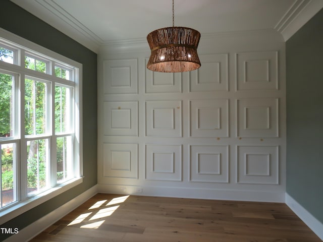 1444 Old Apex Rd, Cary, NC 27513 - unfurnished dining area with crown molding, baseboards, and wood finished floors