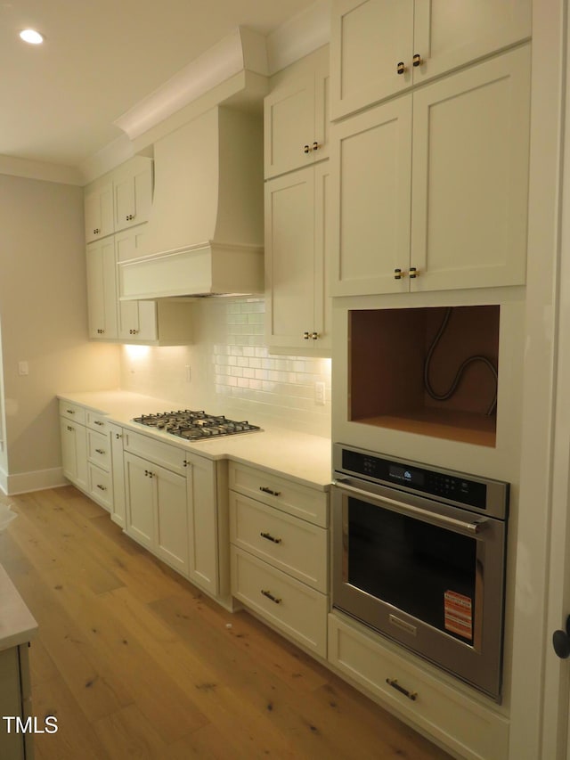 1444 Old Apex Rd, Cary, NC 27513 - kitchen featuring stainless steel appliances, light wood-style flooring, recessed lighting, light countertops, and baseboards