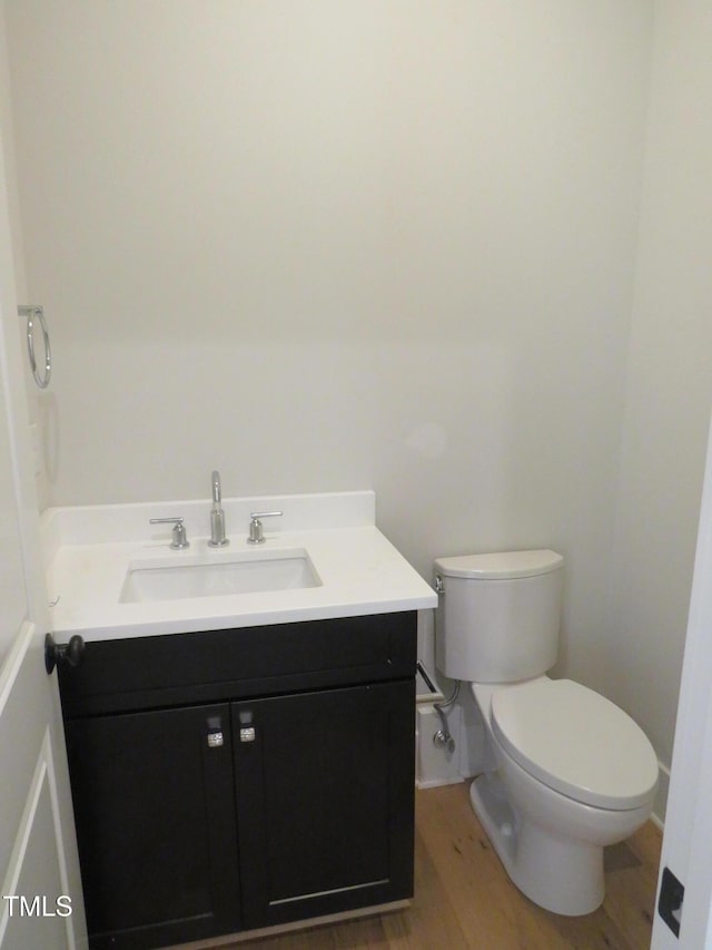 1444 Old Apex Rd, Cary, NC 27513 - bathroom with vanity, wood finished floors, toilet, and baseboards