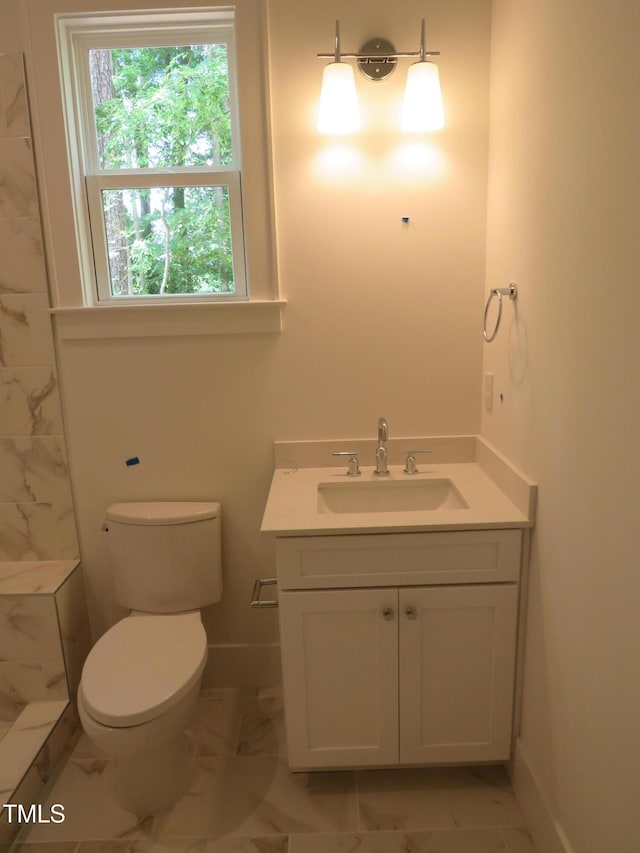 1444 Old Apex Rd, Cary, NC 27513 - full bath with marble finish floors, vanity, toilet, a tile shower, and baseboards