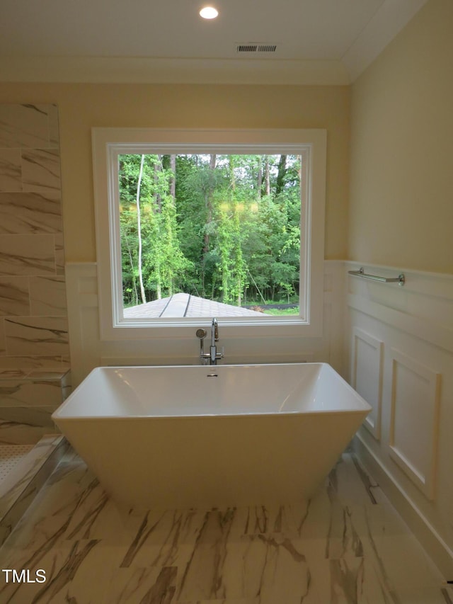 1444 Old Apex Rd, Cary, NC 27513 - bathroom featuring marble finish flooring, plenty of natural light, a wainscoted wall, a soaking tub, and recessed lighting