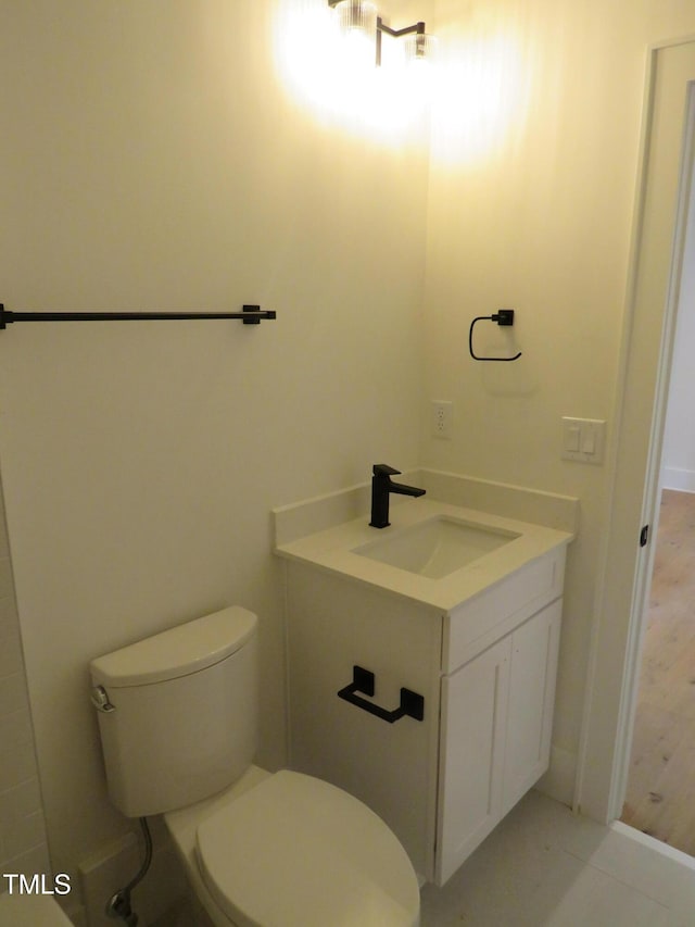1444 Old Apex Rd, Cary, NC 27513 - bathroom featuring toilet, vanity, and baseboards