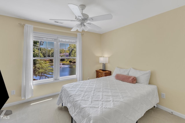 bedroom featuring carpet floors, baseboards, and a ceiling fan