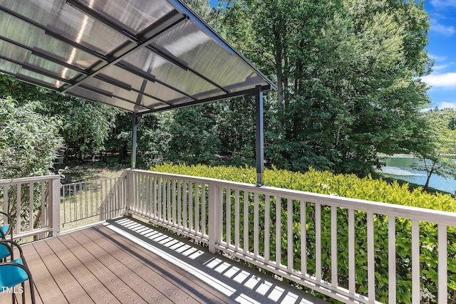 wooden deck featuring a water view