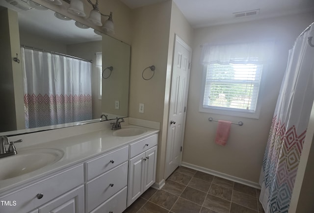 66 Epsom Rocky Ford Rd, Henderson, NC 27537 - full bathroom featuring double vanity and baseboards