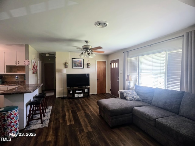 66 Epsom Rocky Ford Rd, Henderson, NC 27537 - living area featuring dark wood finished floors, ceiling fan, and baseboards