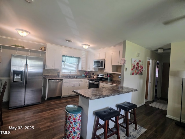66 Epsom Rocky Ford Rd, Henderson, NC 27537 - kitchen with appliances with stainless steel finishes, a sink, dark countertops, and open shelves