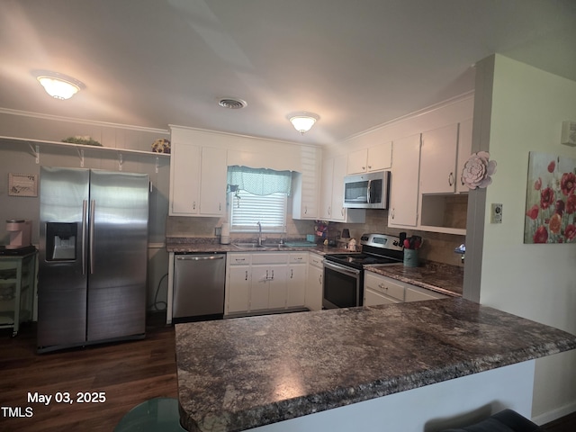 66 Epsom Rocky Ford Rd, Henderson, NC 27537 - kitchen with stainless steel appliances, a sink, open shelves, a peninsula, and crown molding