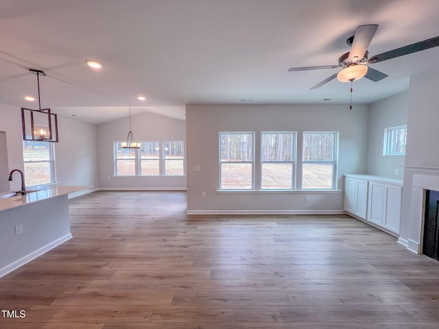 355 Beacon Hill Rd # 23, Lillington, NC 27546 - unfurnished living room featuring a fireplace, wood finished floors, ceiling fan, lofted ceiling, and recessed lighting