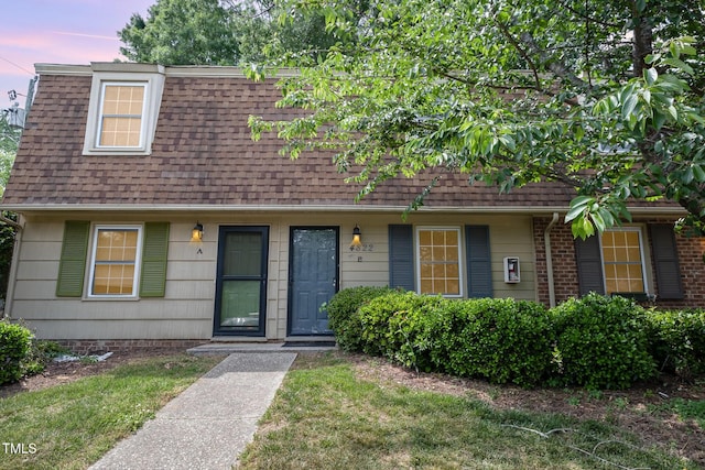 view of front of house with roof with shingles