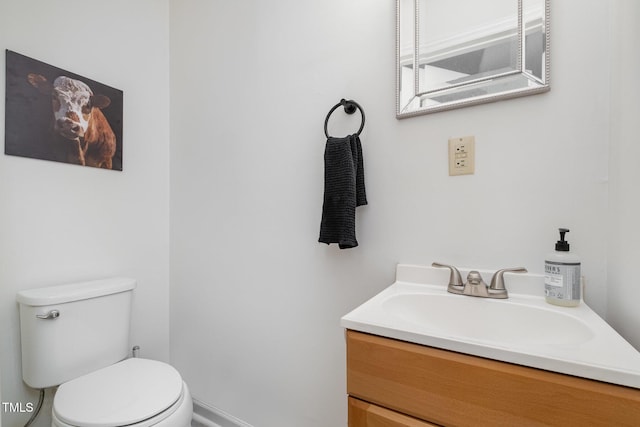half bath with vanity and toilet