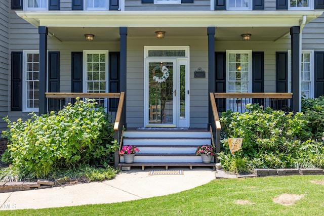 property entrance featuring covered porch