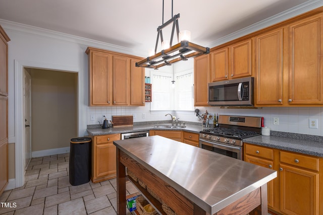 kitchen with stainless steel appliances, a sink, tasteful backsplash, stone finish flooring, and crown molding