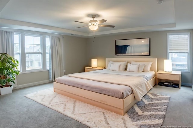 537 Kivett Ct, Fayetteville, NC 28312 - bedroom featuring carpet floors, a ceiling fan, baseboards, and a tray ceiling