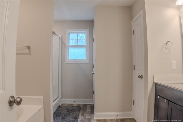 537 Kivett Ct, Fayetteville, NC 28312 - full bath with vanity, baseboards, a stall shower, and a garden tub