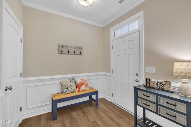 1920 Bright Kannon Way, Wendell, NC 27591 - entryway with crown molding, dark wood-type flooring, a wainscoted wall, and a decorative wall