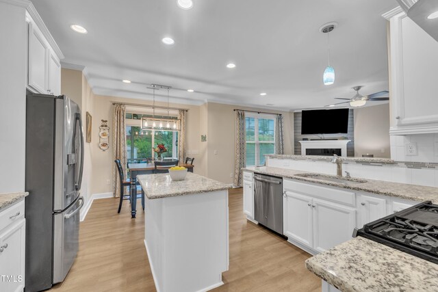 1920 Bright Kannon Way, Wendell, NC 27591 - kitchen with appliances with stainless steel finishes, a sink, a ceiling fan, healthy amount of natural light, and recessed lighting