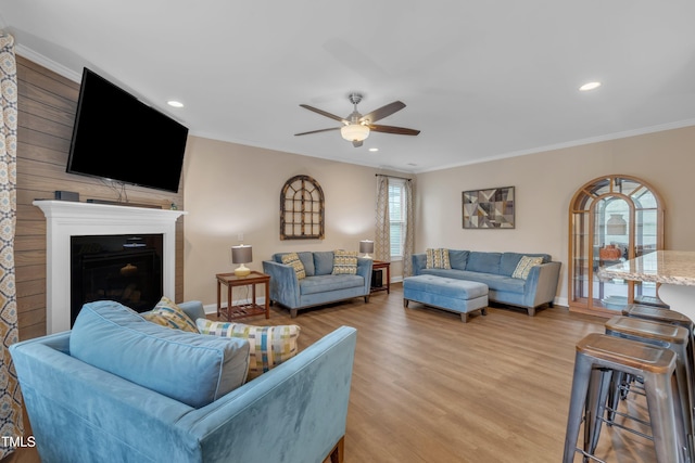 1920 Bright Kannon Way, Wendell, NC 27591 - living area with ceiling fan, crown molding, light wood-type flooring, baseboards, and recessed lighting