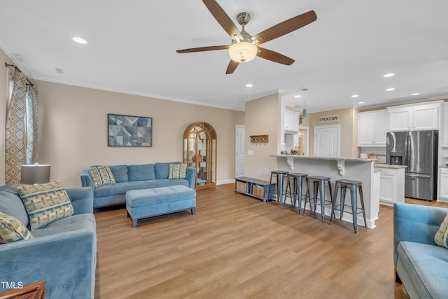 1920 Bright Kannon Way, Wendell, NC 27591 - living area with ceiling fan, ornamental molding, recessed lighting, light wood-style floors, and baseboards