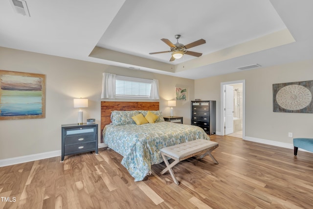 1920 Bright Kannon Way, Wendell, NC 27591 - bedroom featuring a raised ceiling, baseboards, light wood-style flooring, and a ceiling fan