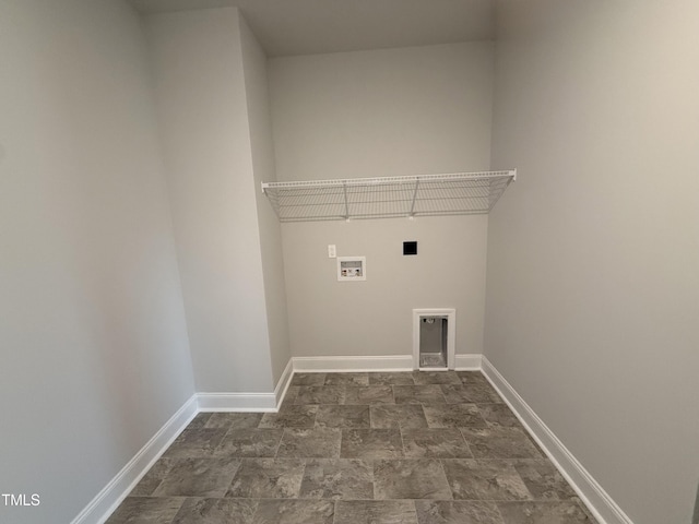 clothes washing area featuring laundry area, baseboards, hookup for a washing machine, electric dryer hookup, and stone finish flooring
