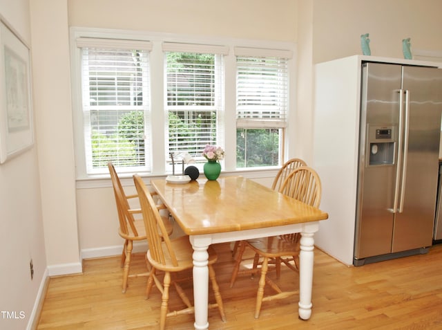 1707 Falls Church Rd, Raleigh, NC 27609 - dining area with light wood finished floors and baseboards