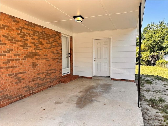 doorway to property with a patio area