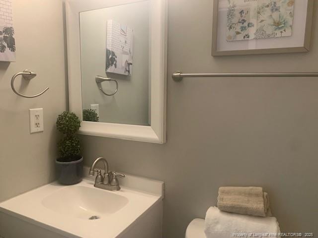 half bath with toilet and vanity