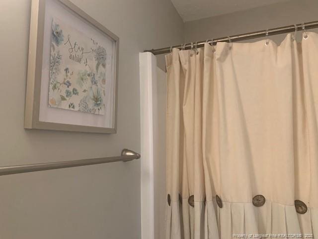 full bath with a shower with curtain