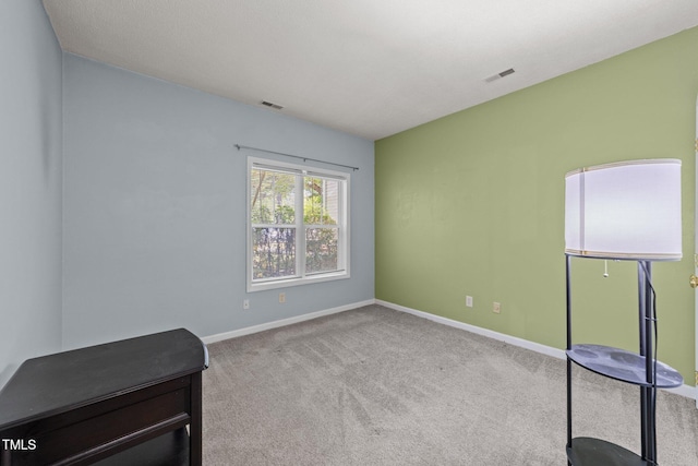 interior space featuring carpet floors and baseboards