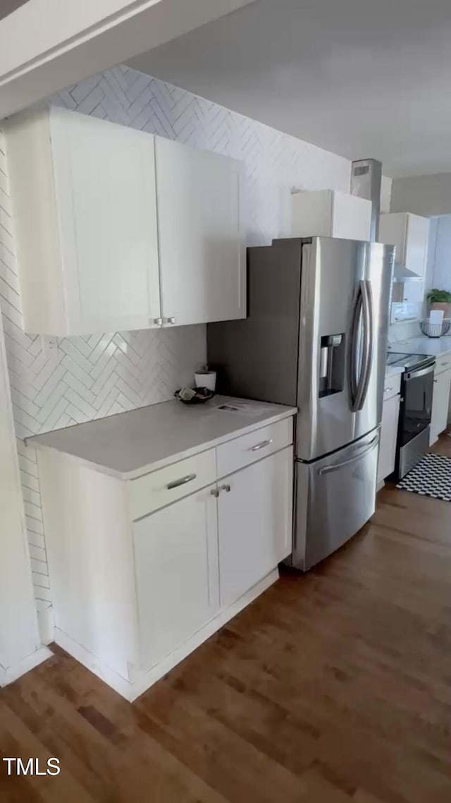 200 S Pettigrew St, Raleigh, NC 27610 - kitchen with stainless steel appliances, white cabinetry, tasteful backsplash, and light countertops