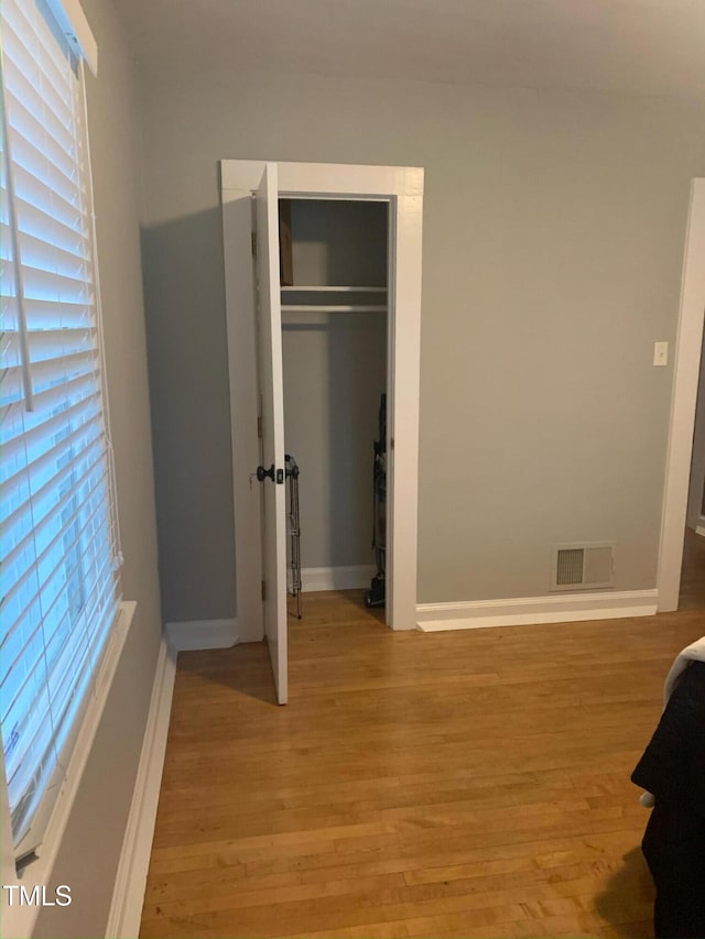 200 S Pettigrew St, Raleigh, NC 27610 - unfurnished bedroom featuring light wood-type flooring and baseboards