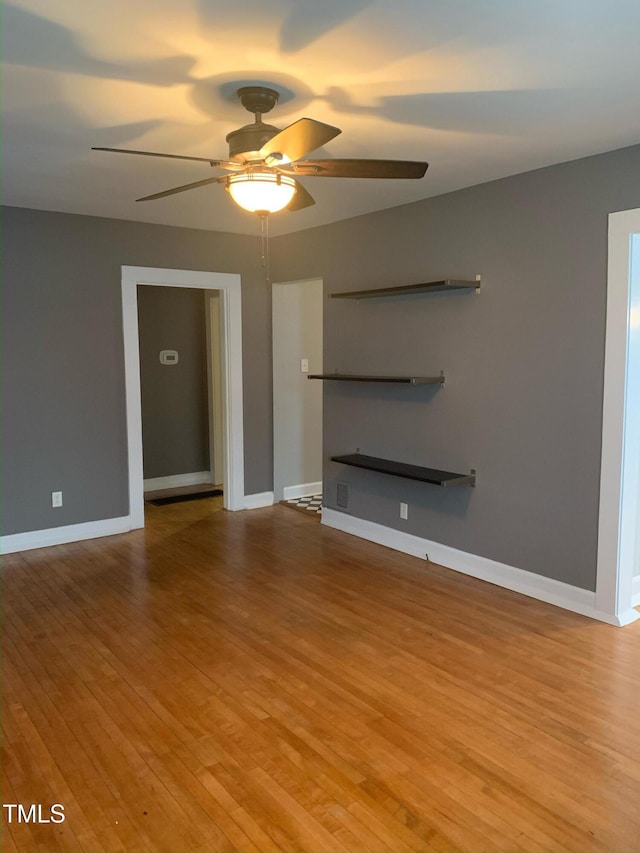 200 S Pettigrew St, Raleigh, NC 27610 - unfurnished living room with ceiling fan, light wood-type flooring, and baseboards