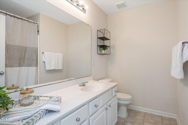 7616 Satinwing Ln, Raleigh, NC 27617 - full bathroom featuring tile patterned floors, vanity, toilet, and baseboards