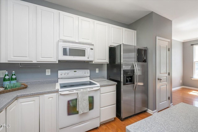 7616 Satinwing Ln, Raleigh, NC 27617 - kitchen with white appliances, light wood-type flooring, white cabinetry, and crown molding