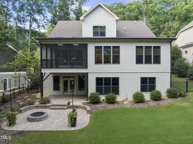 rear view of house featuring a fire pit, fence, a patio, french doors, and a lawn