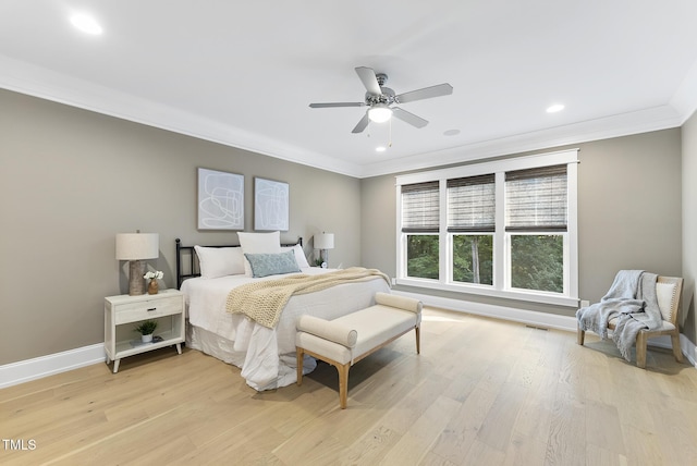 bedroom with light wood-style floors, baseboards, ornamental molding, and recessed lighting