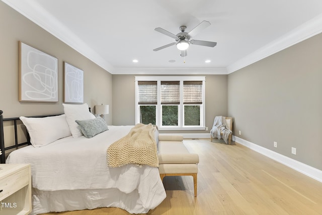 bedroom with crown molding, recessed lighting, baseboards, a ceiling fan, and wood finished floors
