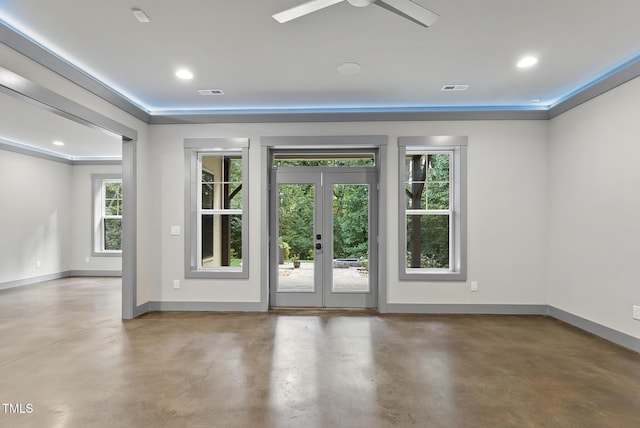 unfurnished room featuring ceiling fan, french doors, visible vents, concrete flooring, and baseboards