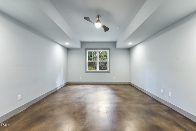 spare room featuring recessed lighting, finished concrete flooring, ceiling fan, and baseboards