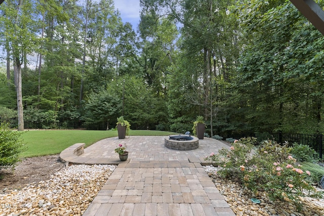 exterior space with fence and an outdoor fire pit