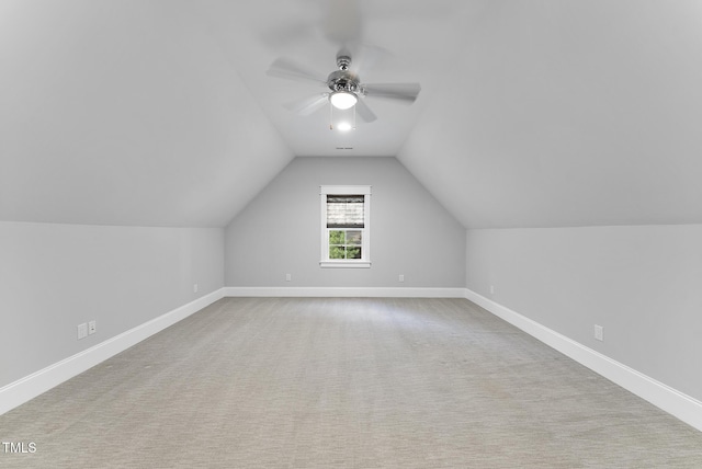 bonus room with baseboards, ceiling fan, carpet flooring, and lofted ceiling