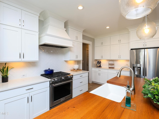 1180 Duke Farm Dr, Wake Forest, NC 27587 - kitchen featuring stainless steel appliances, custom range hood, a sink, decorative backsplash, and white cabinetry