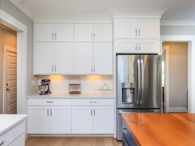 1180 Duke Farm Dr, Wake Forest, NC 27587 - kitchen featuring stainless steel fridge, wooden counters, white cabinets, and backsplash