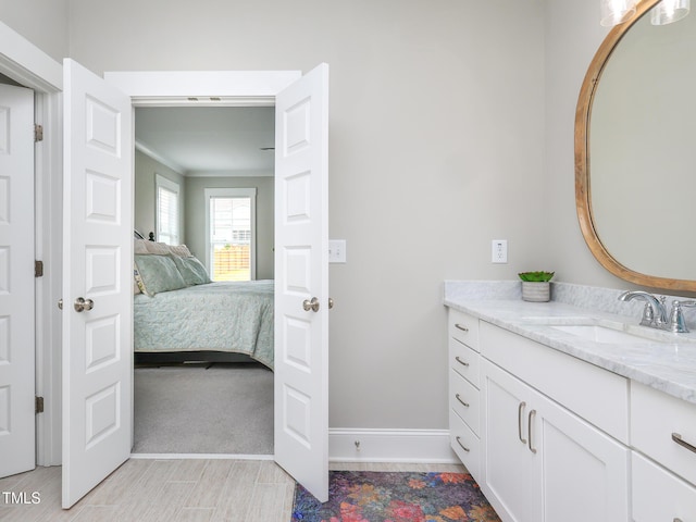 1180 Duke Farm Dr, Wake Forest, NC 27587 - ensuite bathroom with vanity, baseboards, and crown molding
