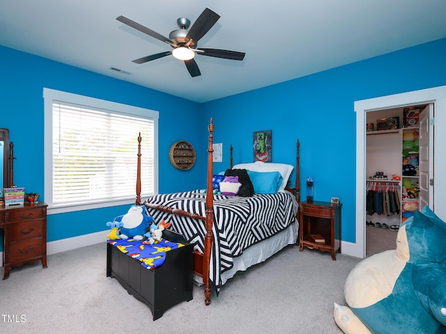 1180 Duke Farm Dr, Wake Forest, NC 27587 - bedroom featuring a spacious closet, carpet, ceiling fan, and baseboards
