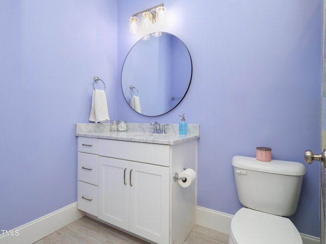 1180 Duke Farm Dr, Wake Forest, NC 27587 - bathroom with toilet, baseboards, vanity, and wood finished floors