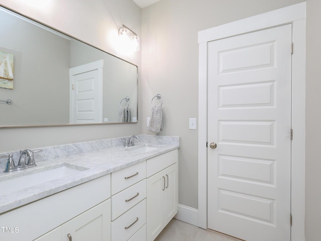 1180 Duke Farm Dr, Wake Forest, NC 27587 - bathroom featuring double vanity and baseboards